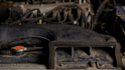Neck of radiator in engine compartment of the car