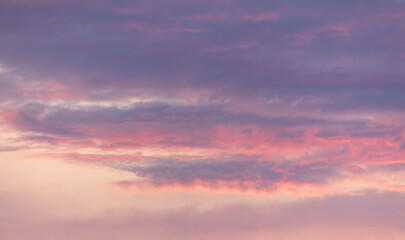 Pink blue clouds at sunset as background