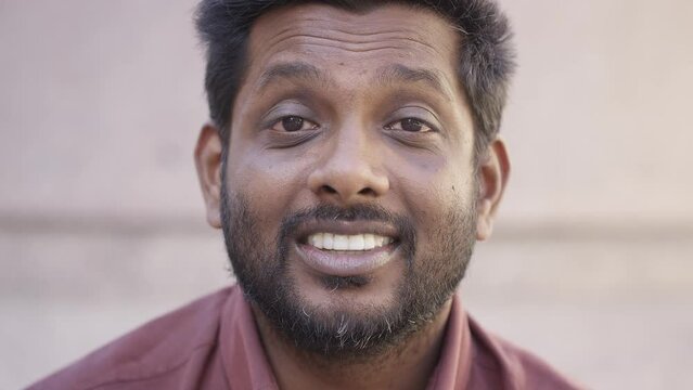 Portrait of casual male in the city talking to camera in an interview style