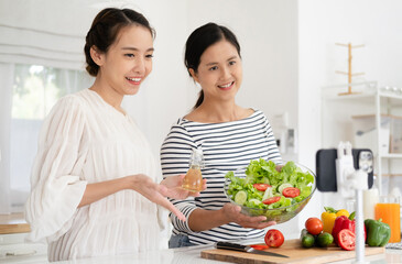 two positive people make selfie recording video smiling greetings prepare cooking healthy salad in kitchen