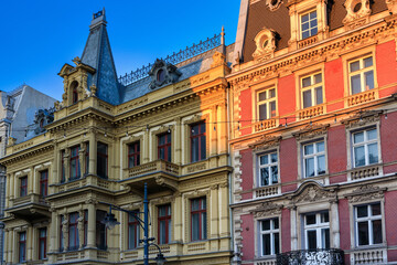 Fototapeta na wymiar Beautiful architecture of Piotrkowska Street in Lodz city at sunrise. Poland