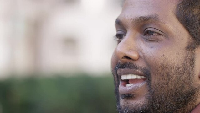 Portrait of handsome male talking to someone off camera in an interview style