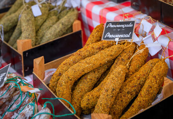 Artisanal pork sausages with provencal herbs in a box at Cours Saleya farmers market stall in Old Town, Vieille Ville in Nice, French Riviera, France
