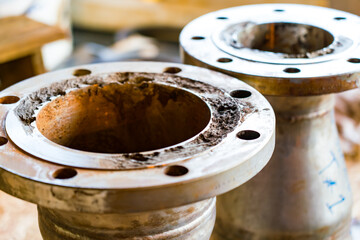 Severe corrosion of pipe flanges in the petroleum industry.
