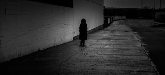 Woman walking at night