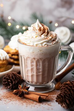 A cup of hot chocolate with whipped cream and cinnamon. Digital image.