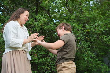 An authentic image of a mother and her pre-teen son in a garden, reflecting the values of childhood and family bonding for social initiatives