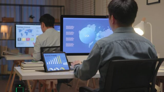 Asia people expert man tech talent night working late on predict sales insight SEO graph chart AI smart plan visual big data science report center BI tools screen. Office worker asian analyst job.