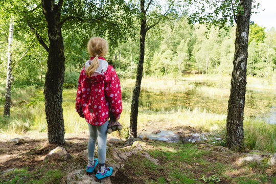 Girl exploring forest on vacation