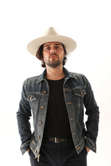 Fototapeta premium Caucasian handsome young man on white background wearing fedora hat. Vertical.