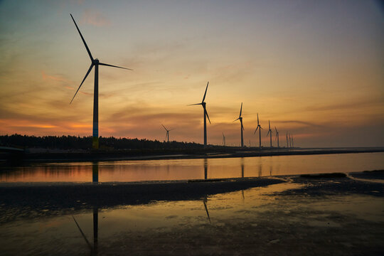wind turbines at sunset