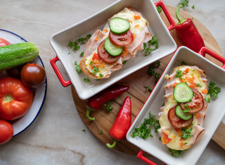 Baked baguette sandwich with chicken ham, cheddar cheese and fresh garden vegetables. Zero waste...