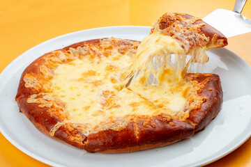 Adjar-style khachapuri with cheese, egg and butter. Caucasian cuisine. Isolated image on a gray background.