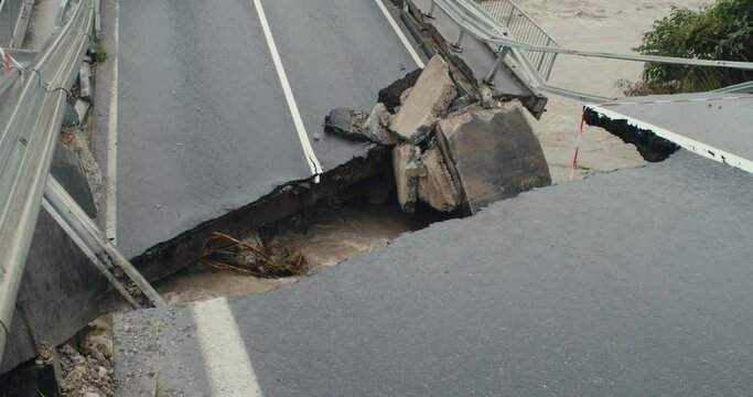 Collapsed bridge catastrophe river floods water road damage detail