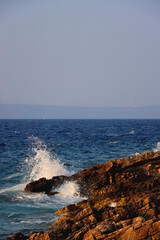 Waves crashing on the rocky beach on island Korcula, Croatia.