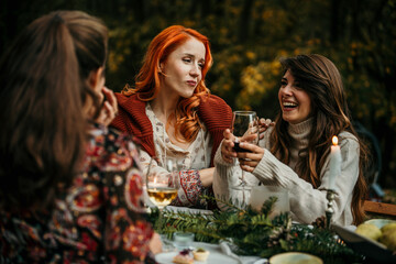The essence of a memorable garden lunch, where female friends come together to create cherished moments in a picturesque outdoor setting
