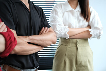 Startup business people standing with their arms crossed at corporate office. Motivation, community, vision and teamwork