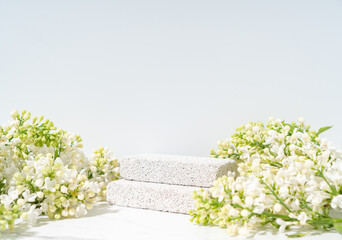 Eco friendly cosmetics skin care product presentation scene made with pumice stones and blossom...