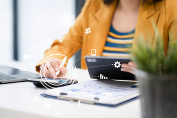 Business woman working on laptop and accounting financial report, accountant using calculator to calculate tax refund at office.