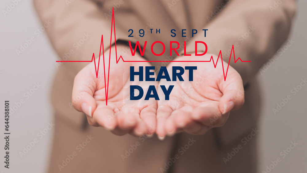 Wall mural world heart day concept. woman hands with heartbeat pulse on gray background