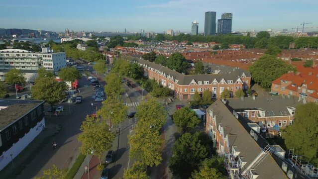 Backward aerial of Vogelbuurt with houses, apartments and flats in Amsterdam Noord