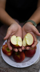 Close up hand holding apple