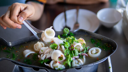 Close up women eating seafood