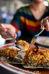 Close up women eating seafood