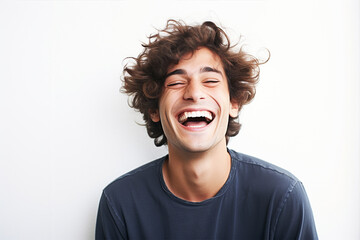.Portrait of a laughing young man on a white background