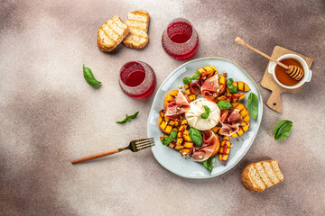 Gourmet Roasted Peach with Burrata soft cheese, prosciutto ham, basil and honey, for wine....