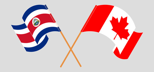 Crossed and waving flags of Costa Rica and Canada