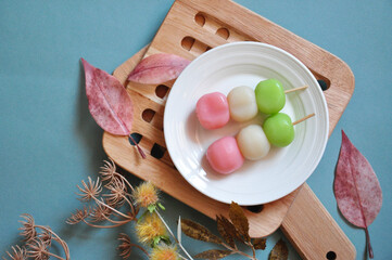 Top view of Japanese Dessert Dango on Blue Background