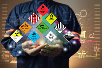 Hazardous substance concept chemical safety officer at a dangerous goods warehouse holding hologram...