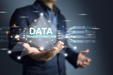 Data transformation concept. Businessman holding hologram complex data with smart device digitalization to transfer around the world with big data technology.
