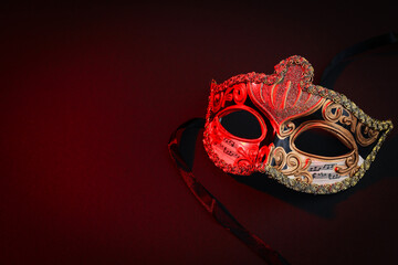 Carnival mask on dark background, space for text