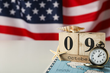 Columbus Day. Calendar with a clock on the background of the American flag