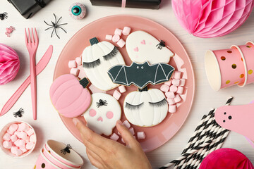 Halloween themed cookies in a bowl. Pink Halloween concept