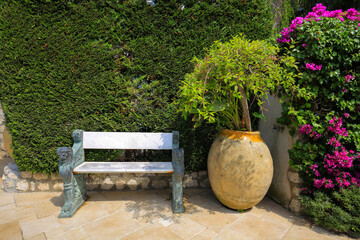 Outdoor bench and big flower pot in Eze