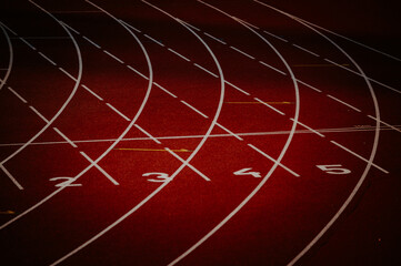 Track and Field Wallpaper. The Intersection of White Lines and Numbers on a Striking Red Track