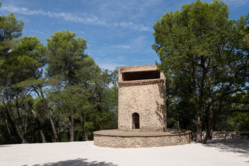 19th-century Fuveau pigeonnier: 22m stone tower, Provençal landmark. Once a windmill, now historic gem, France