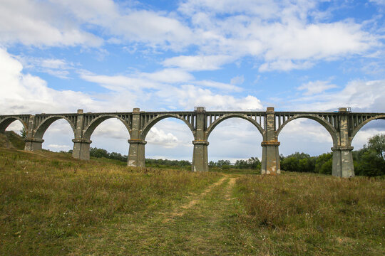 View of the abandoned old Mokrinsky railway bridge. Russia, the village of Mokry, the bridge was built in 1918 - Powered by Adobe