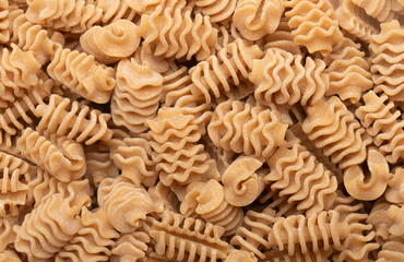 Background of Italian wholemeal radiatori type pasta