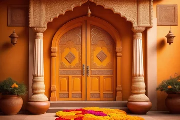 Fotobehang An ornate door adorned with marigold flowers and colorful rangoli patterns welcoming visitors during Diwali © Zen