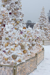 Fototapeta na wymiar festive Christmas tree decorated with bright toys. New Year's Holiday