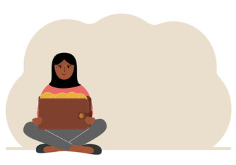 A woman sits cross-legged and holds a large purse of coins. The concept of a savings wallet, a successful loan, golden earnings with metal money in the currency.