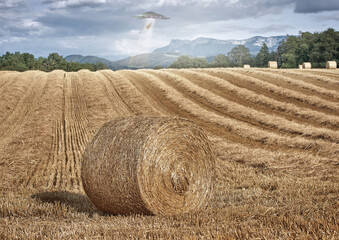 UFO, farm and field with alien spaceship invasion, hay or tractor beam light for research. UAP,...