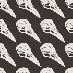 Flat vector seamless pattern with bird skulls. Design for the day of the dead or Halloween. Illustration for wrapping paper, textiles, backgrounds.