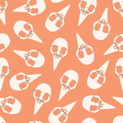 Flat vector seamless pattern with bird skulls. Design for the day of the dead or Halloween. Illustration for wrapping paper, textiles, backgrounds.