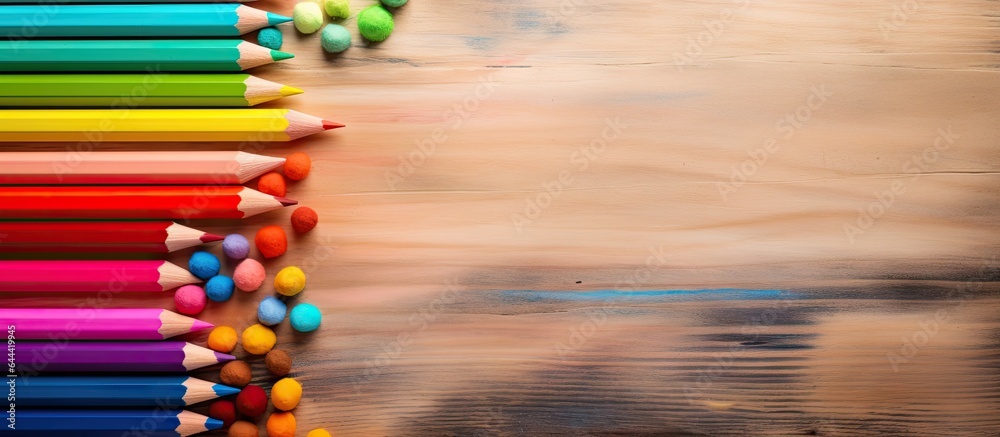 Aufkleber Selective focus on multi colored pencils and particle on a isolated pastel background Copy space