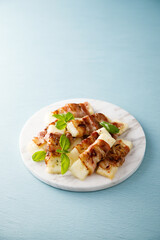 Roasted bacon-wrapped halloumi cheese 